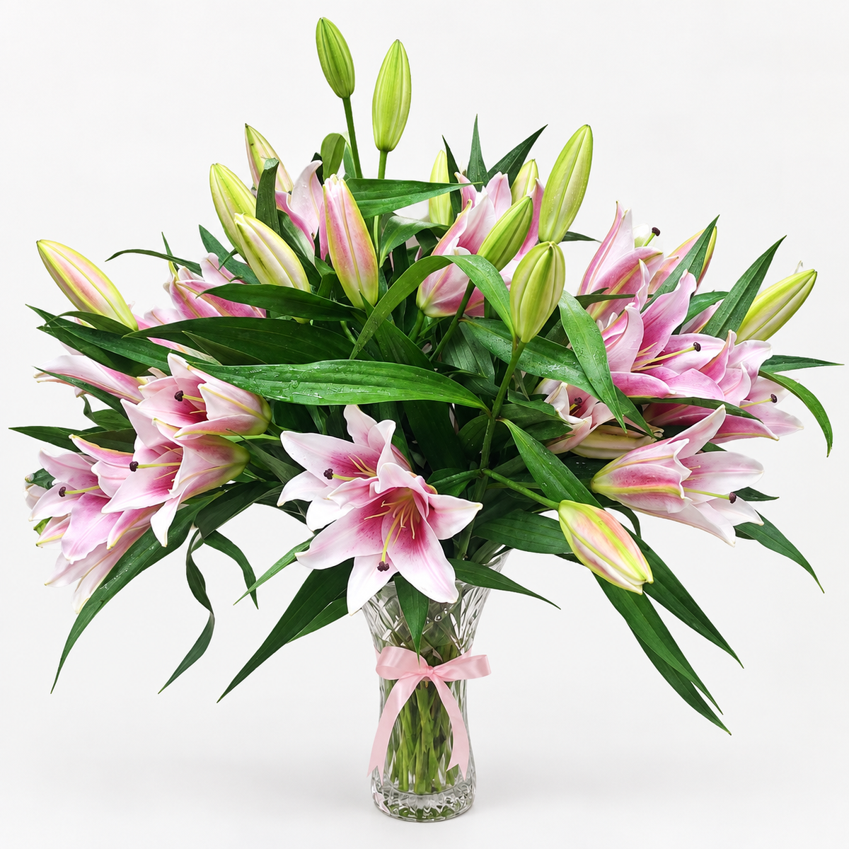 10 fresh pink lilies in clear glass vase