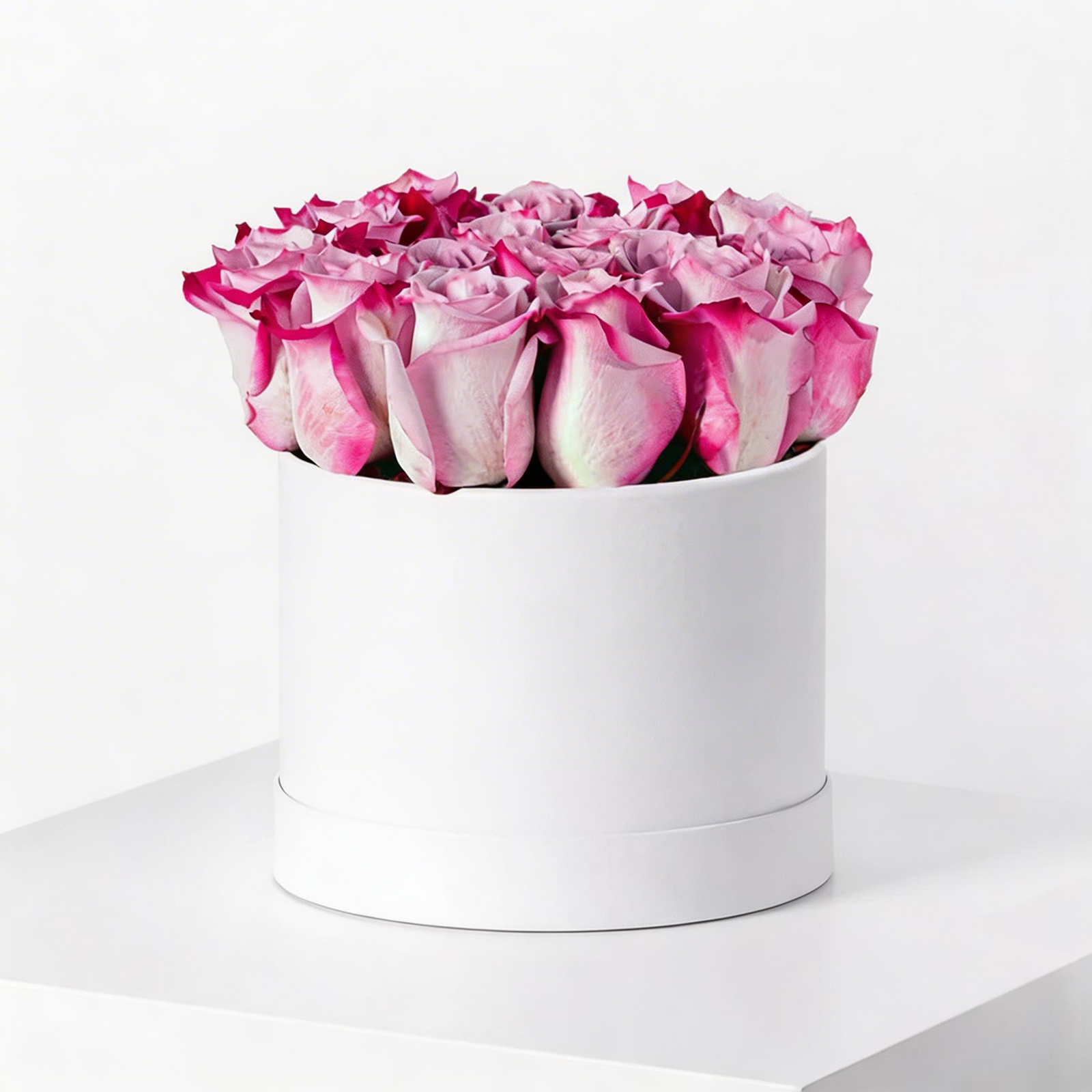 20 premium purple roses arranged in a luxury white flower box with same-day flower delivery in Kuwait.