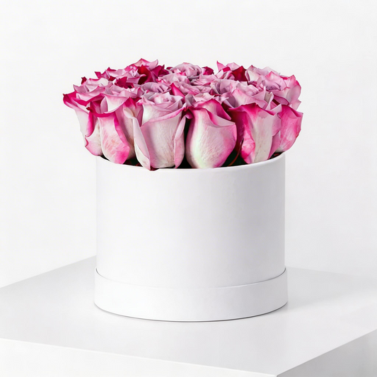 20 premium purple roses arranged in a luxury white flower box with same-day flower delivery in Kuwait.