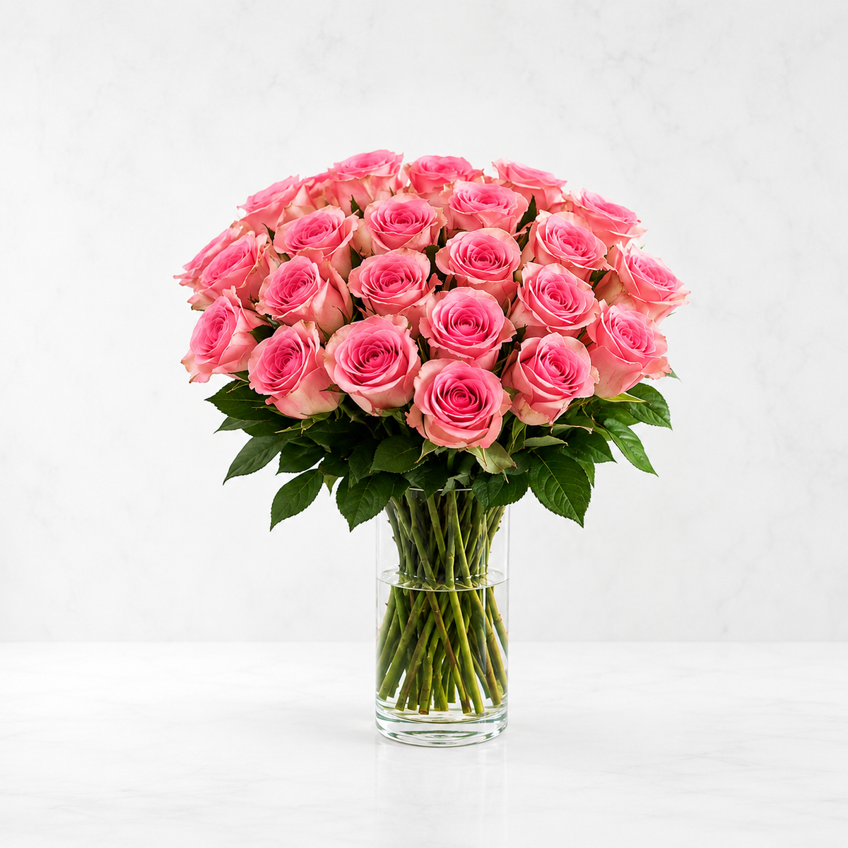 pink roses in a glass vase with fresh pink roses flowers