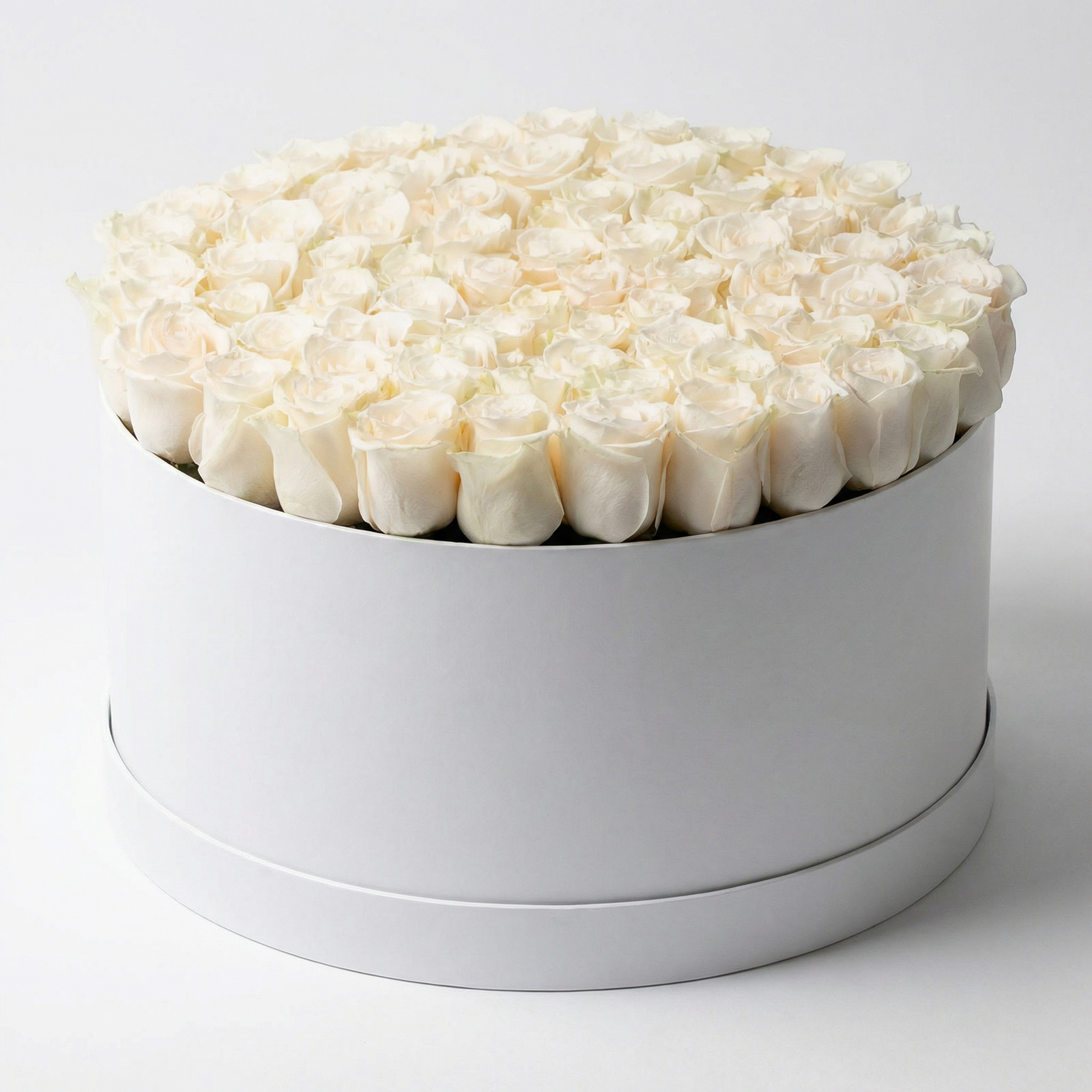 Order the 60 White Roses Flower Box from Flowers in Kuwait. Premium white roses in a luxury white round box with same-day delivery across Kuwait.