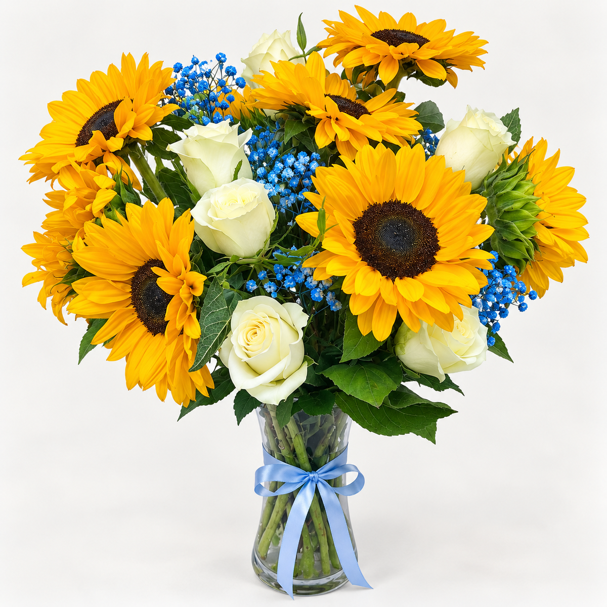 8 sunflowers with white roses and blue baby's breath in a vase