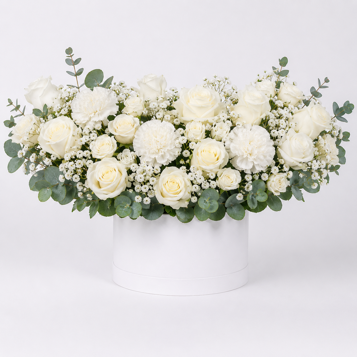 Elegant white floral arrangement in hatbox