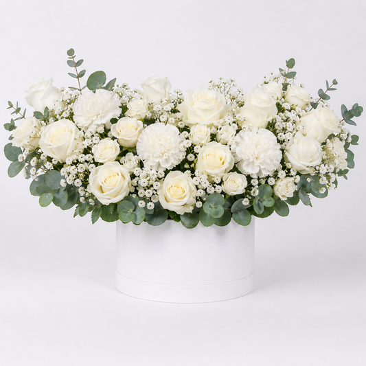Elegant white floral arrangement in hatbox