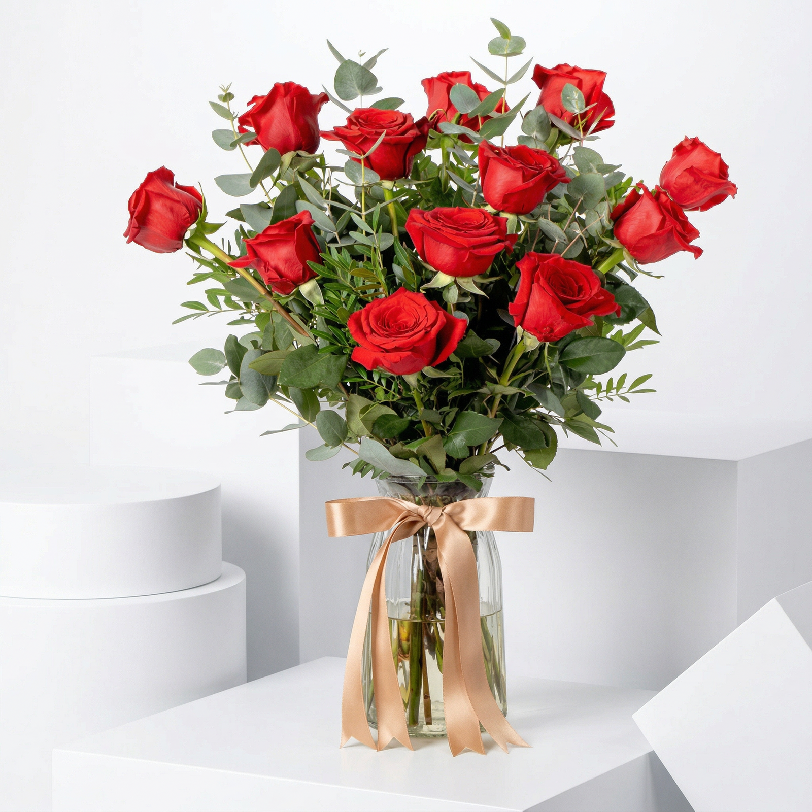 Elegant Dozen Red Roses in Glass Vase with Fresh Greenery