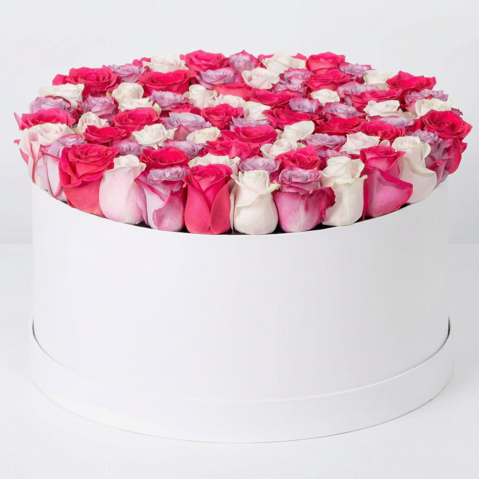 Elegant Mixed Rose Flower Box with premium red, pink, lavender purple and white roses arranged in a luxury white flower box.