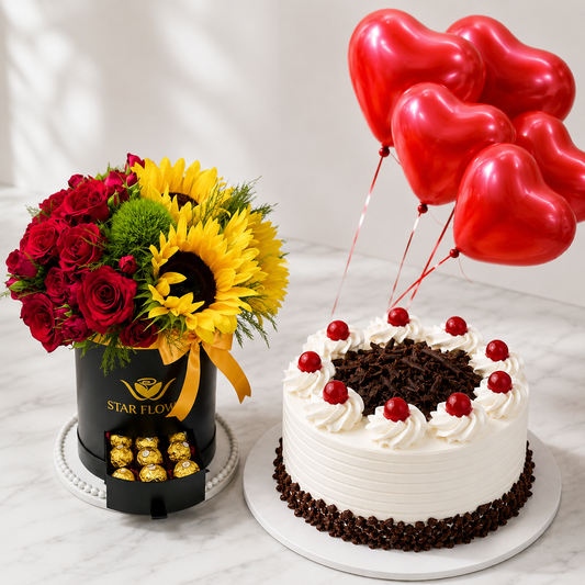 Luxury Red Baby Roses, Sunflower, Black Forest Cake, Ferrero & 5 Red Heart Helium Balloons Gift Combo