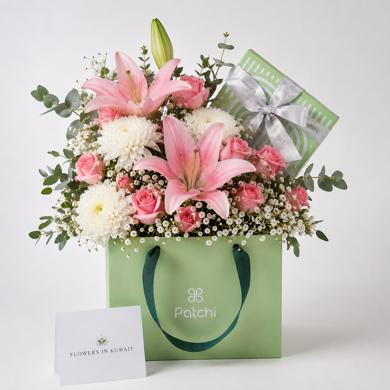 Pastel Pink Patchi Chocolate Flower Gift with 500g Patchi chocolates, pink roses, lily and white chrysanthemums for birthdays, anniversaries and special occasions.