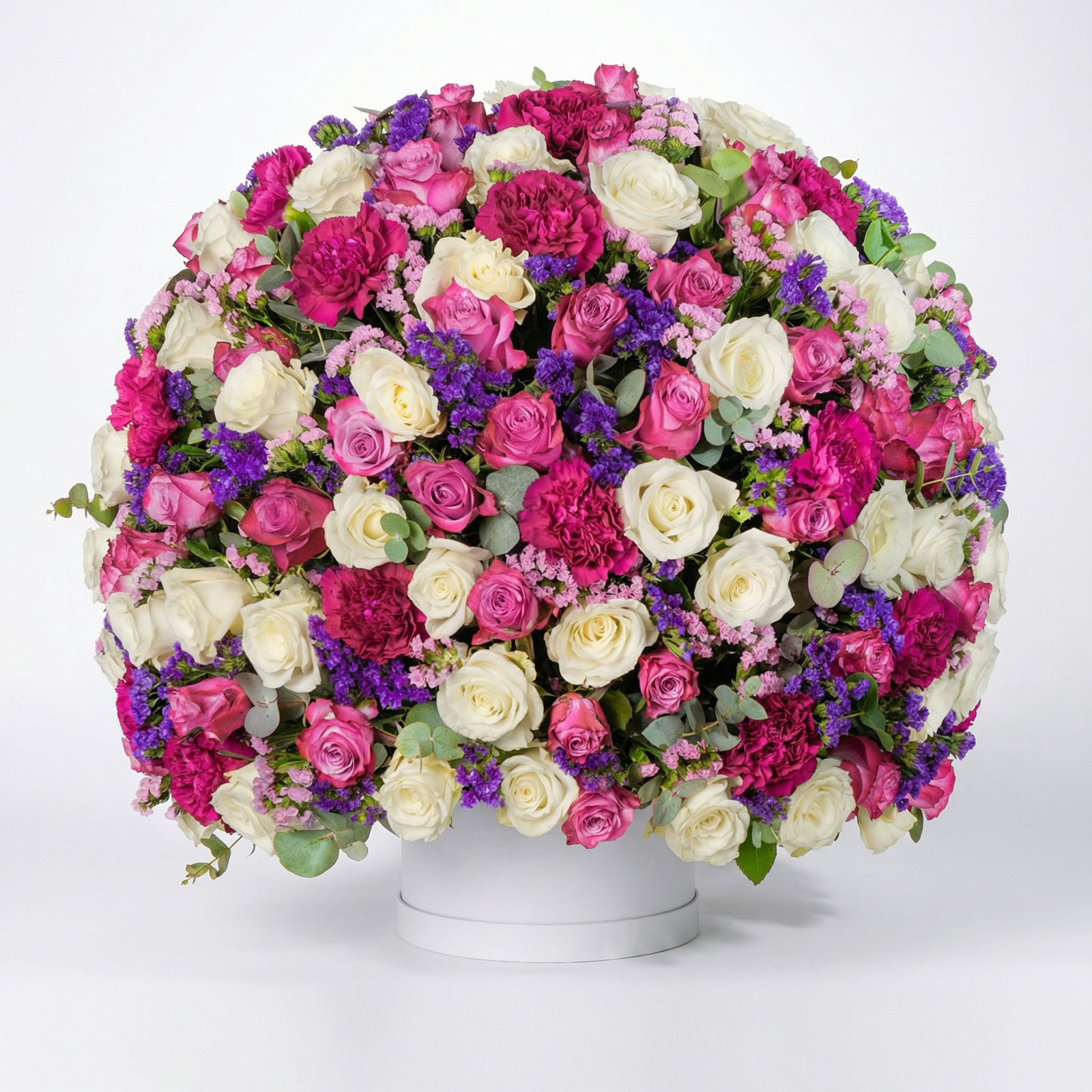 Signature Mixed Flower Box with white roses, pink roses and purple carnations in a luxury white flower box.