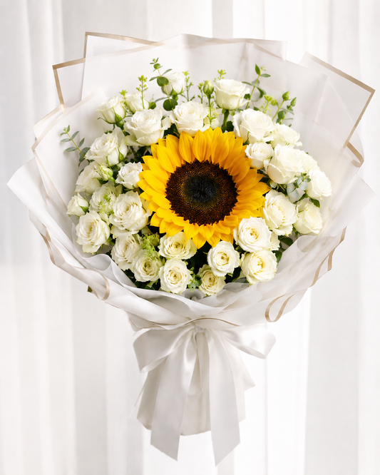Sunflower and White Baby Roses Bouquet handcrafted by expert florists in Kuwait with same-day flower delivery.