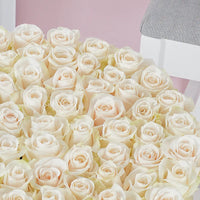 Bouquet of white roses with a soft pink background order online any where in the world we delivered across kuwait.